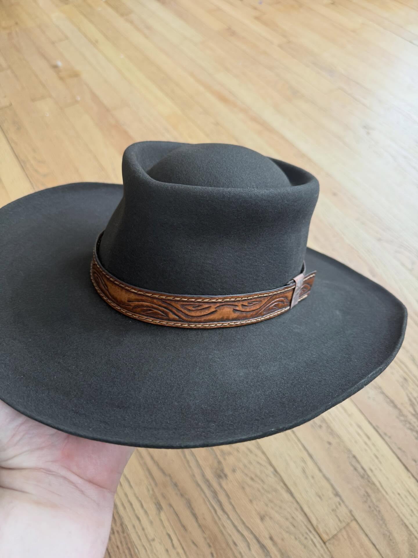 Olive felt hat with hand-tooled cognac leather hatband